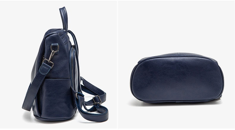 Navy blue leather bags with detailed features on a white background
